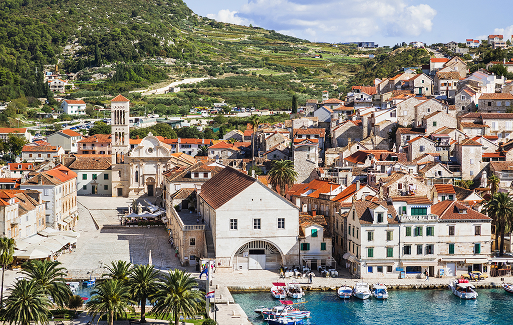 The Square of St. Stephen in elegant Hvar Town, on the island of Hvar, Croatia. Tasteful Croatian Journeys' recommendation for the best place to travel to in August