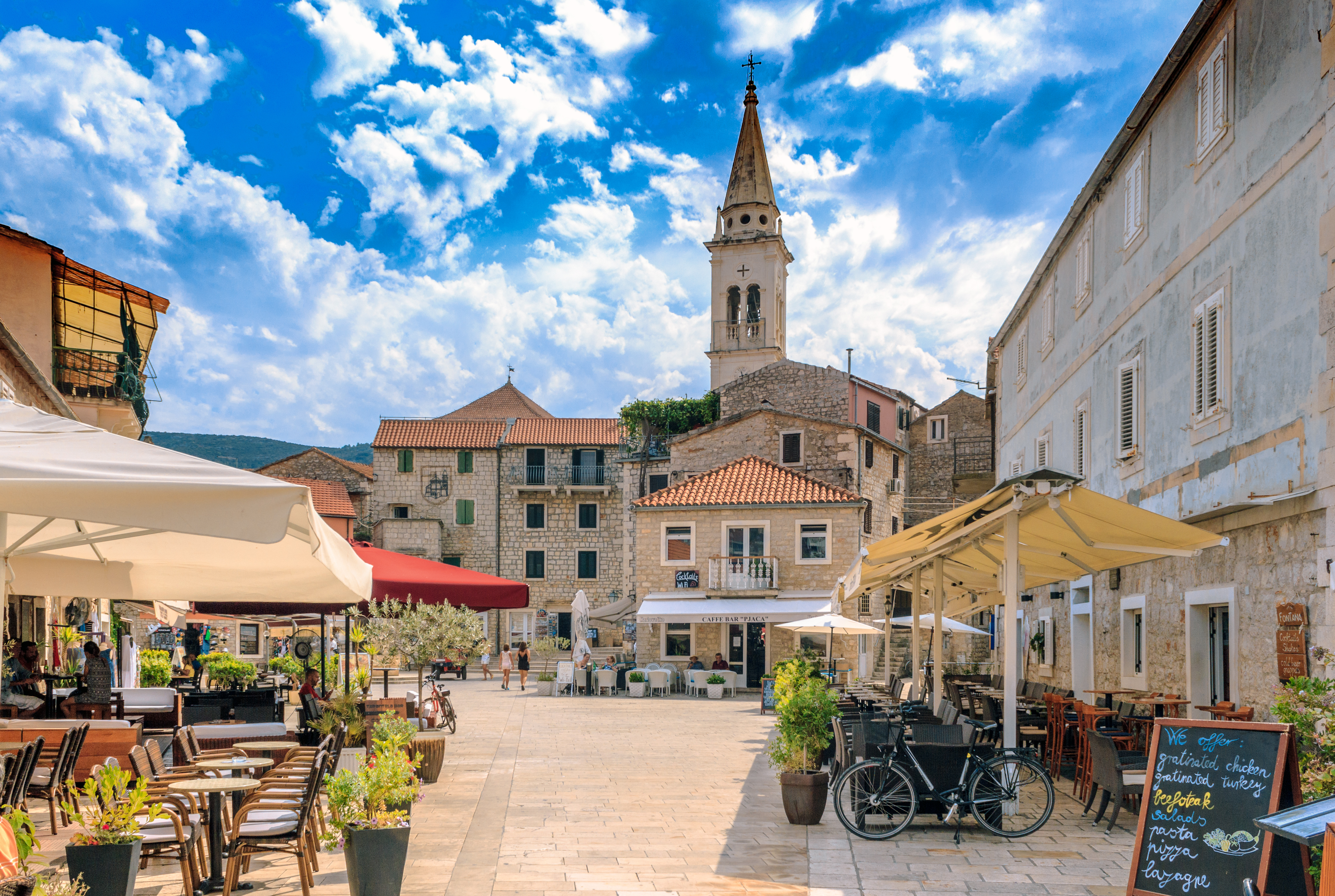 Stone buildings with terra cotta roof tiles in the center of Jelsa