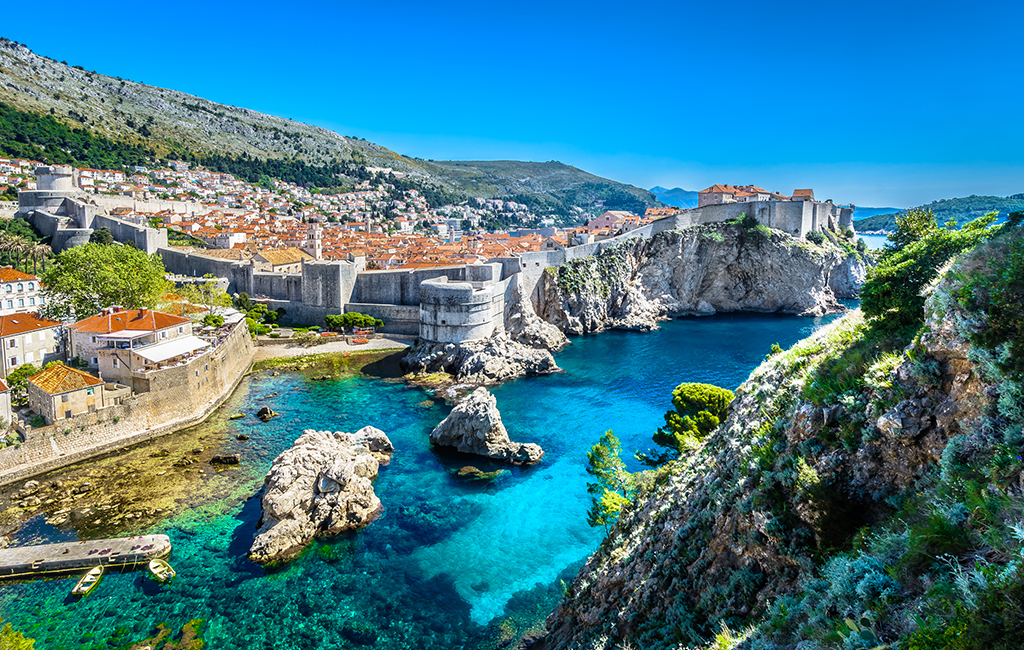 The walled city of Dubrovnik, Croatia, seen from a distance. Tasteful Croatian Journeys' recommendation for the best place to visit in March. 