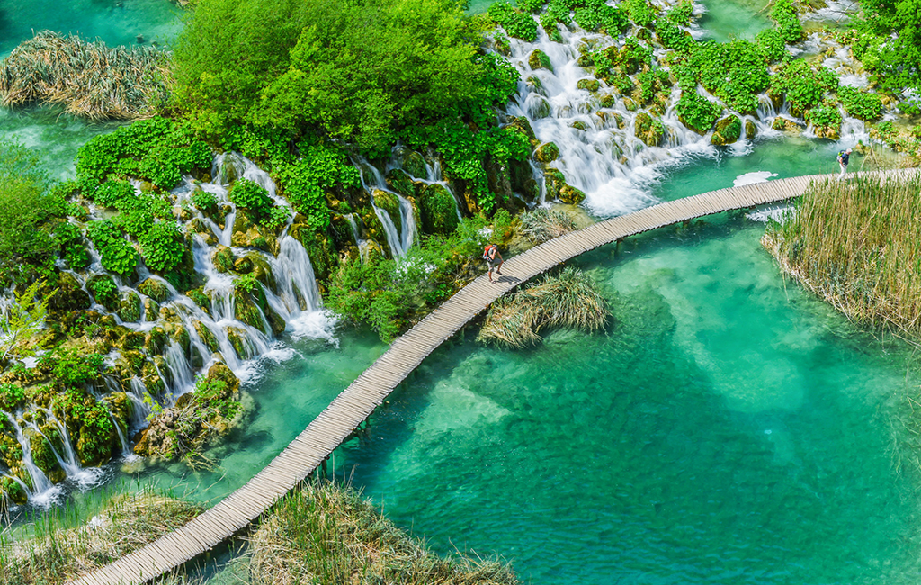 Wooden footbridges in Plitvice Lakes National Park, Croatia. The best time to visit Plitvice Lakes National Park is May, according to luxury travel company Tasteful Croatian Journeys