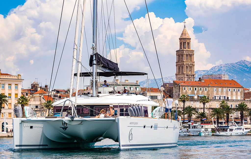Catamaran Arctic Queen departing Split, Croatia to sail the Adriatic. The best time for an island-hopping itinerary in the Adriatic is September, according to travel specialists at Tasteful Croatian Journeys
